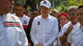 Presiden ketujuh Joko Widodo (tengah) tiba untuk menghadiri Rakorda DPD Partai Solidaritas Indonesia (PSI) di kota Bandar Lampung, Lampung (Dok: Istimewa)